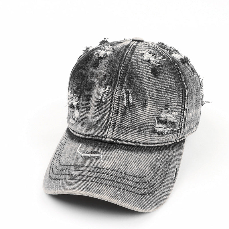 Casquette baseball denim noire effet washed déchirée style streetwear