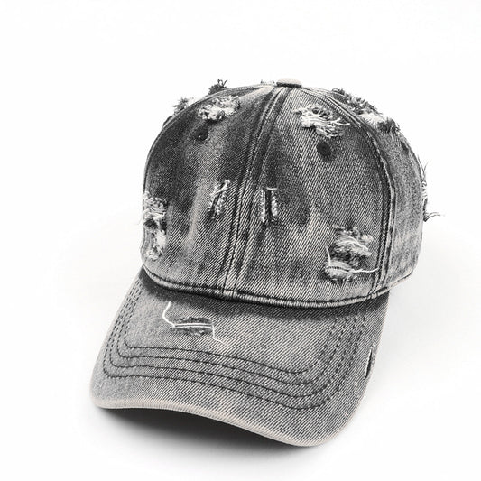 Casquette baseball denim noire effet washed déchirée style streetwear